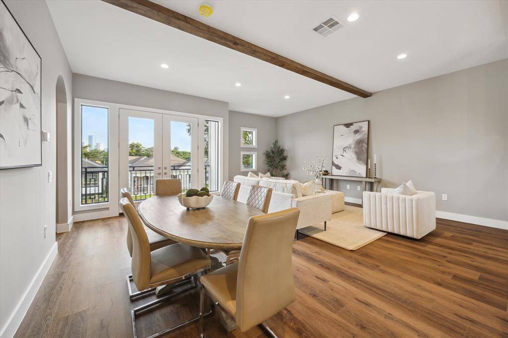 Flooded with natural light, this bright and open space is anchored by French doors that open to the private balcony—perfect for enjoying your morning coffee with Downtown views.