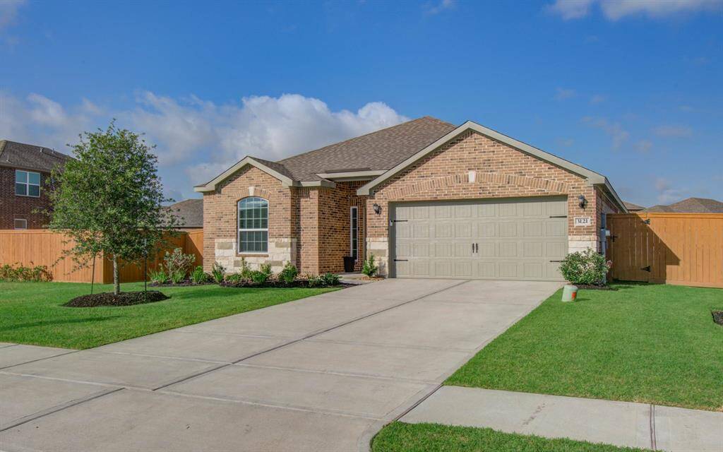 Stunning full brick home with elegant stone and brick front elevation.