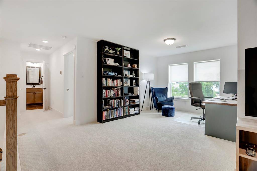 At the landing on the third floor sits a flex space with a multitude of uses. Currenlty used a an additional study, the options are endless for your needs.