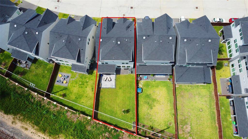 Aerial shot of the property shows the large backyard space perfectly.