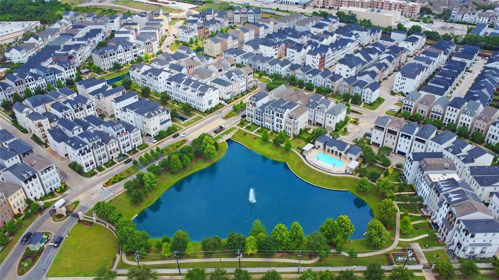 Aerial shot of the community pool and lake.