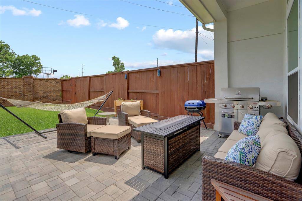 Just off the dining area is a 350+ square foot paver patio (partially covered) and offers space to entertain inside and out.