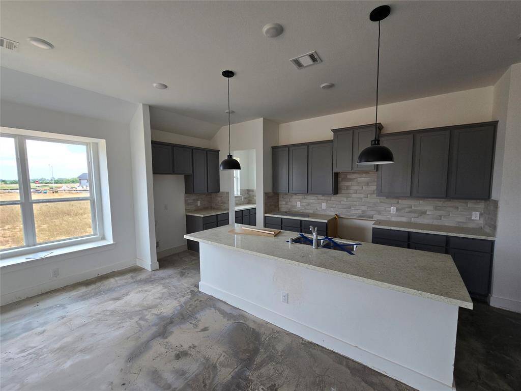 Whip up a batch of Grandma's secret cookies recipe in this sleek stunner of a kitchen!