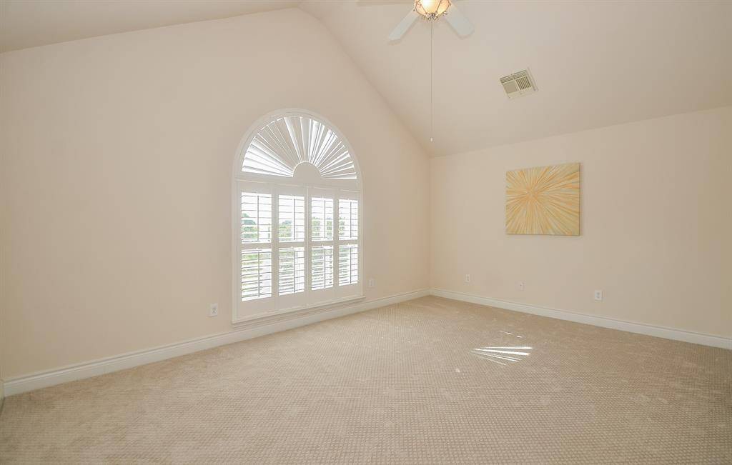 Soaring Ceilings and Beautiful Architectural details adorn the Primary Bedroom.