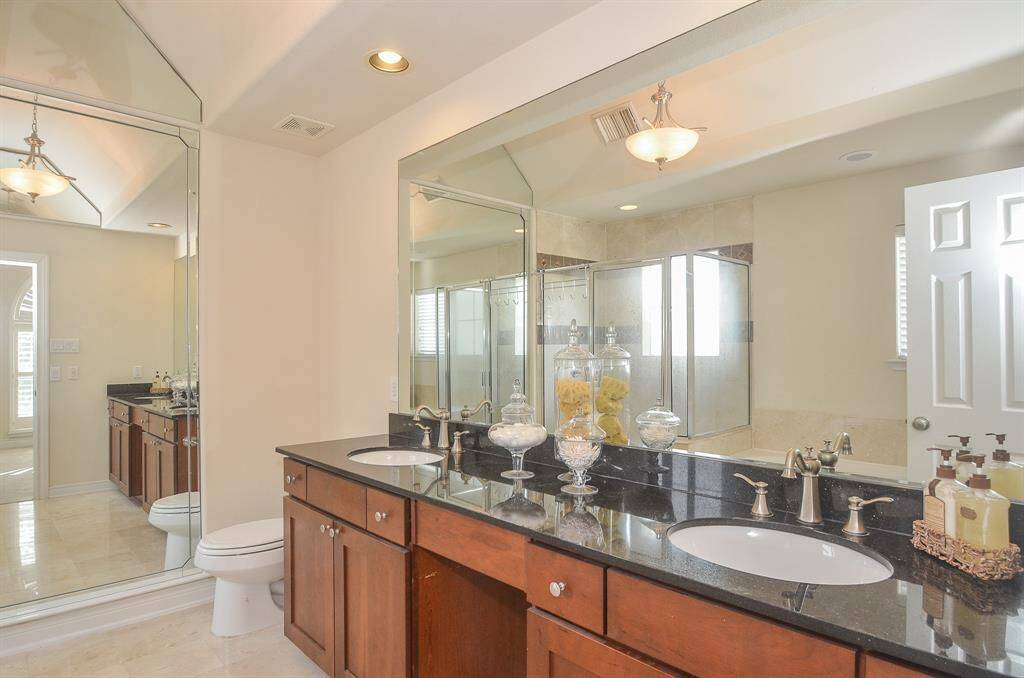 Enormous Ensuite with double sinks and Soaring Ceilings.