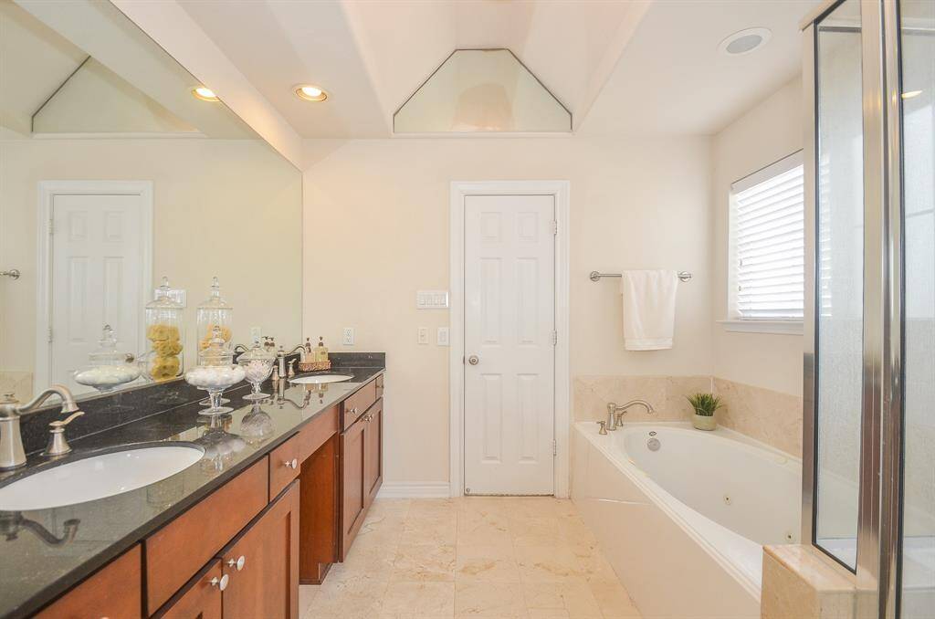 Large whirlpool tub and walk-in shower.