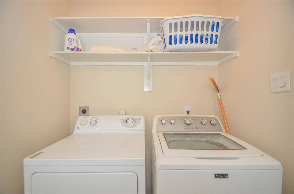 Laundry room with washer and dryer included