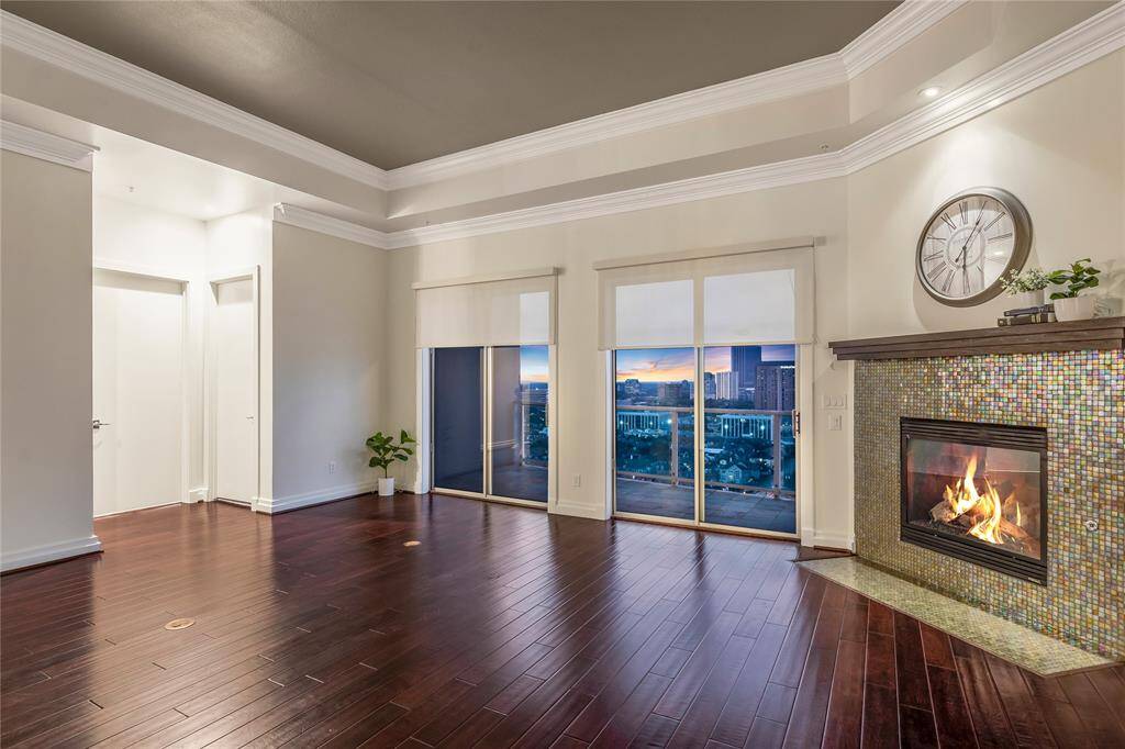 The floors are amazing! To the immediate left is a secondary bedroom with a full bathroom next to it.