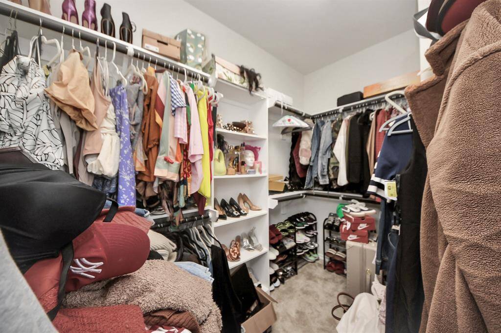 one of the closets in the primary suite
