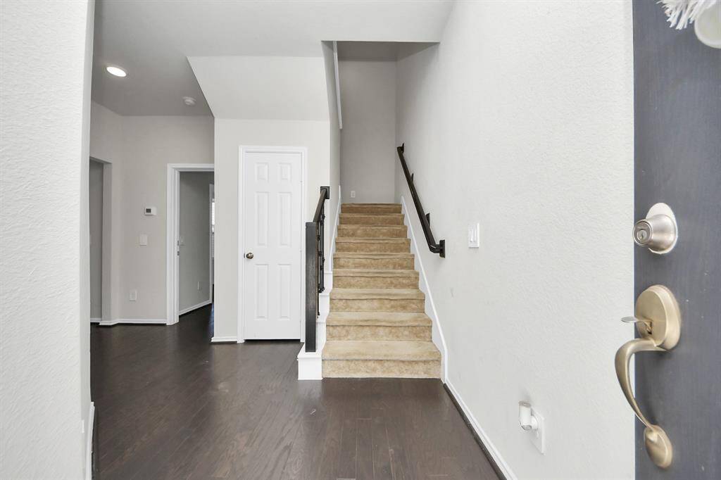 Front door leads directly to the guest quarters on the first level of home