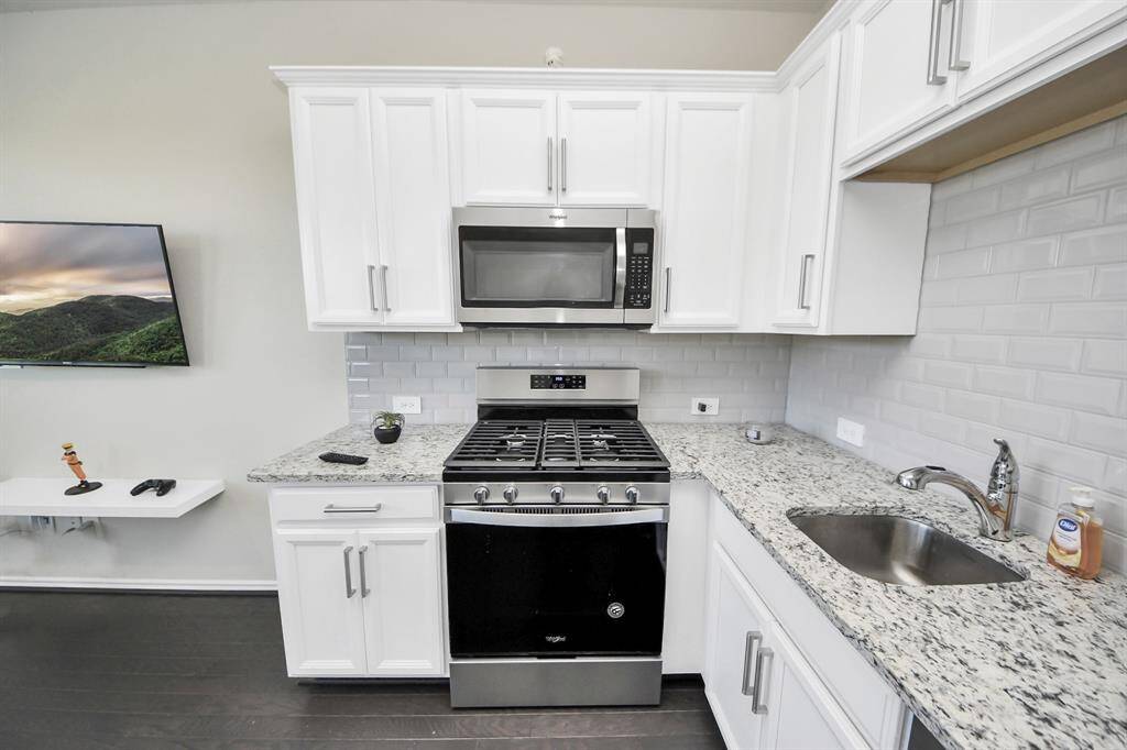 Kitchenette comes equipped with a oven, gas range, microwave and fridge