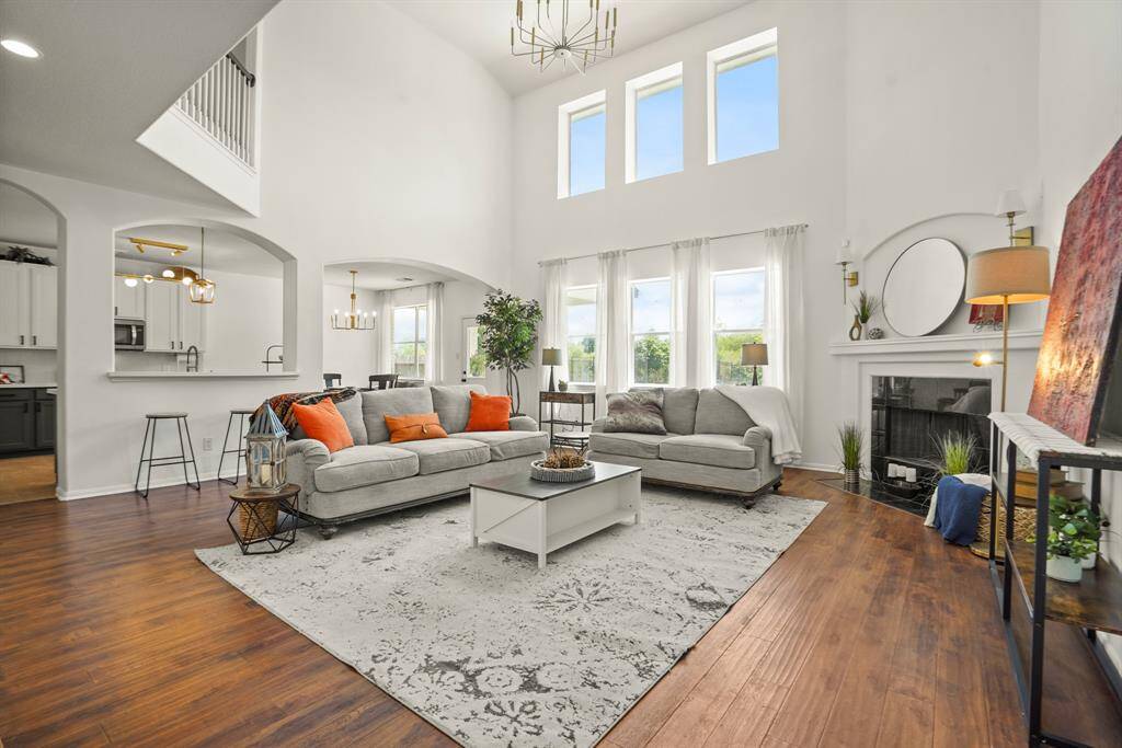 Expansive windows showcase stunning lake and backyard views.