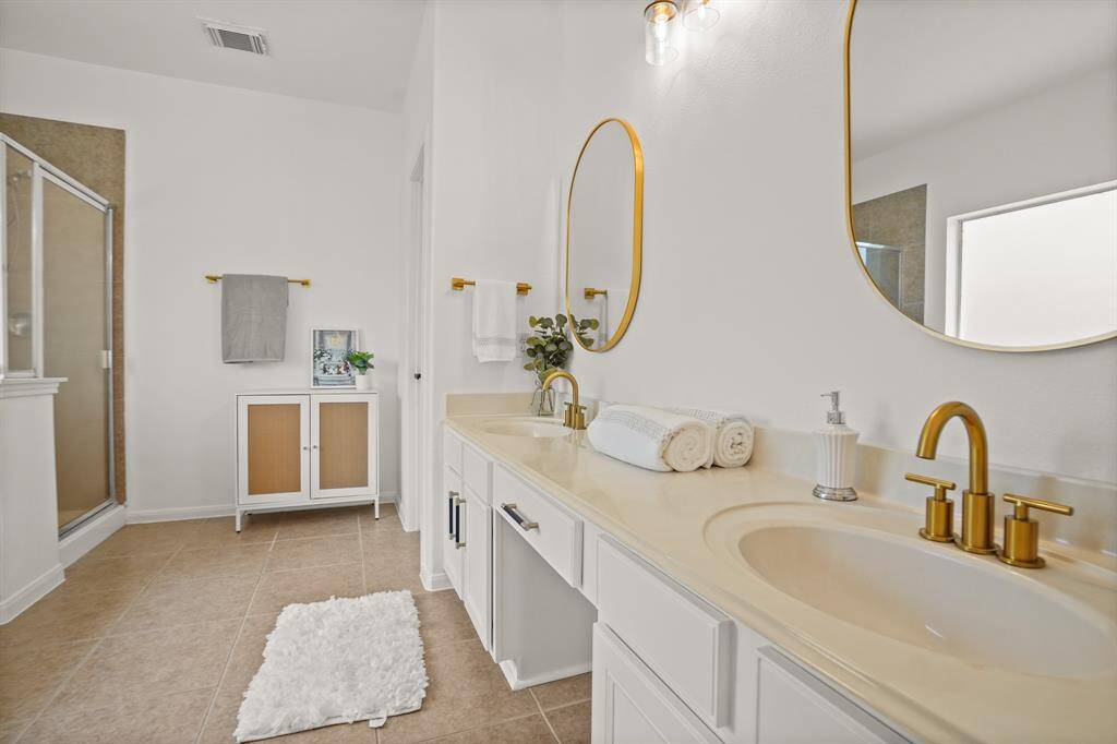 Primary ensuite #1 - updated lighting and hardware.  Huge Closet with large built-in