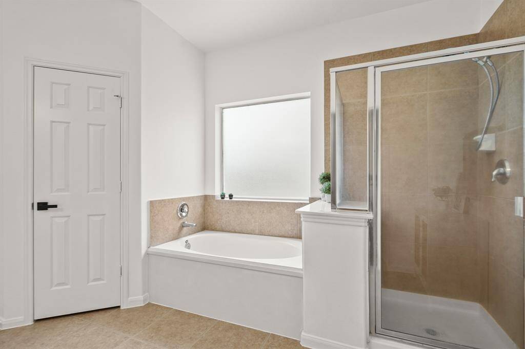 Luxurious bathroom with a separate shower and relaxing soaking tub.