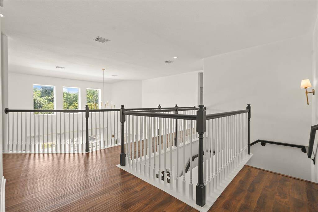 Elegant staircase offering a panoramic view of the entire first floor.