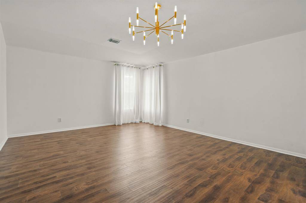 Spacious upstairs primary suite, perfect for relaxation and comfort.