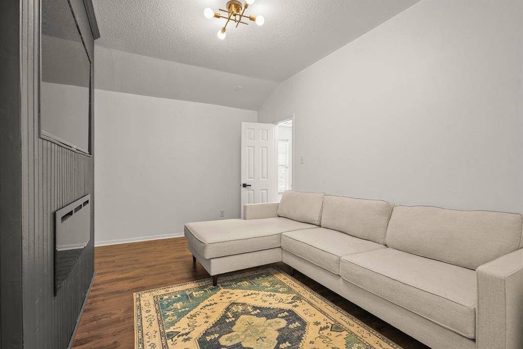 Transform your entertainment experience in this versatile media/game room, perfect for movie nights and gaming fun.