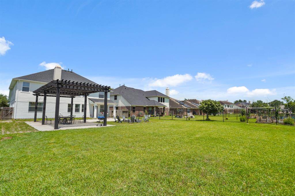 Expansive double pergola and fire pit perfect for entertaining guests.