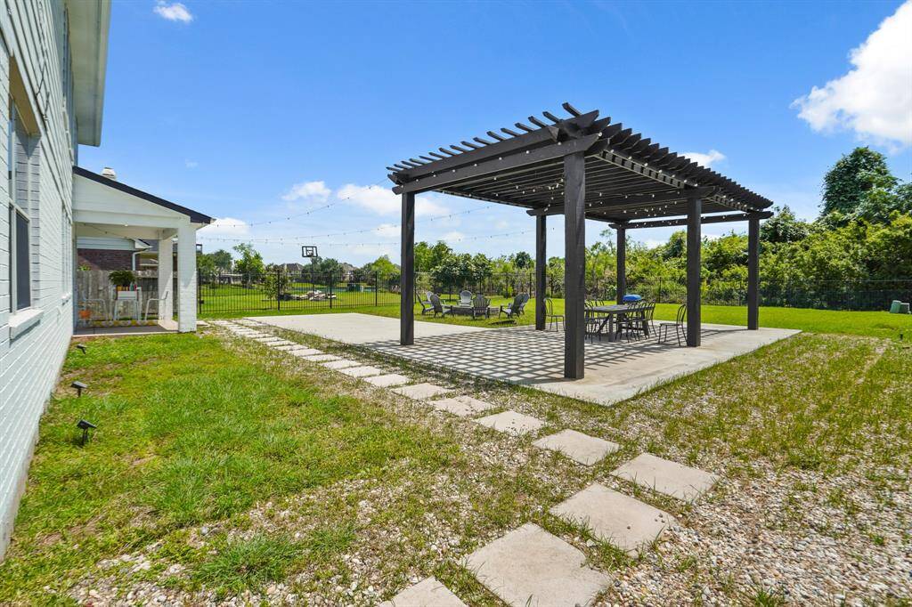 Spacious double pergola perfect for outdoor dining and relaxation.