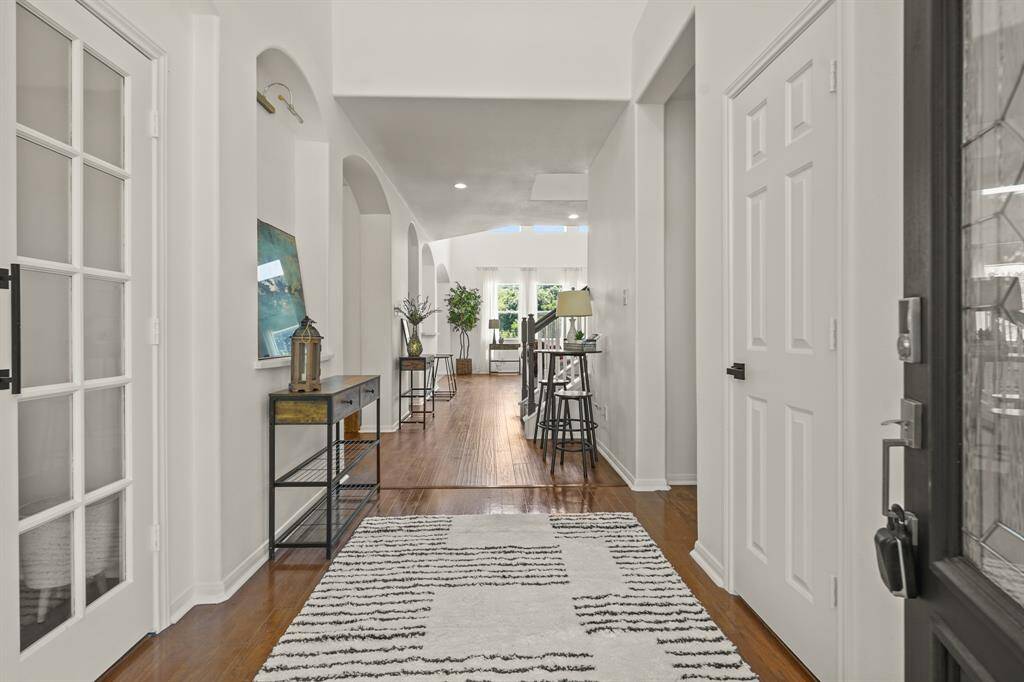 Discover a welcoming entryway that combines sophistication with warmth, featuring elegant design and ample natural light.