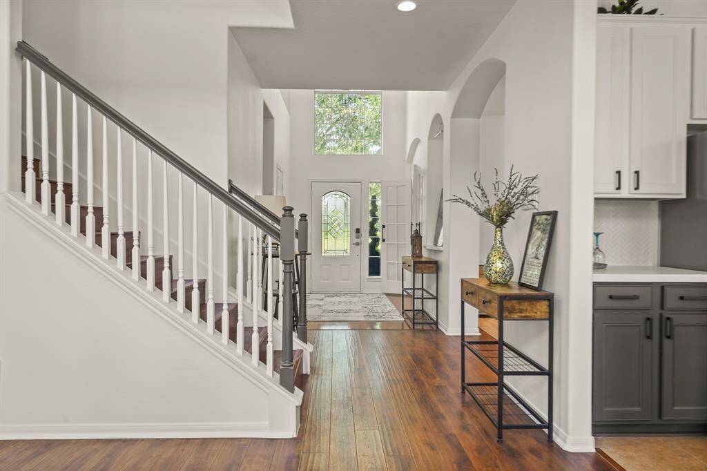 Welcome home to an elegant staircase entry, featuring sleek lines and inviting design.