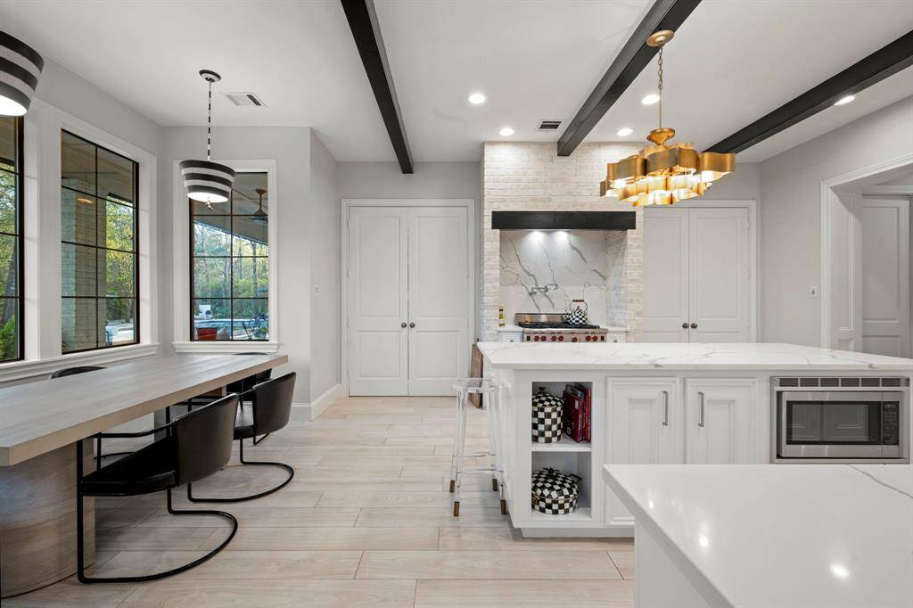 This kitchen has two sets of double doors. Creating a more intimate space in the formal dining/living during events.