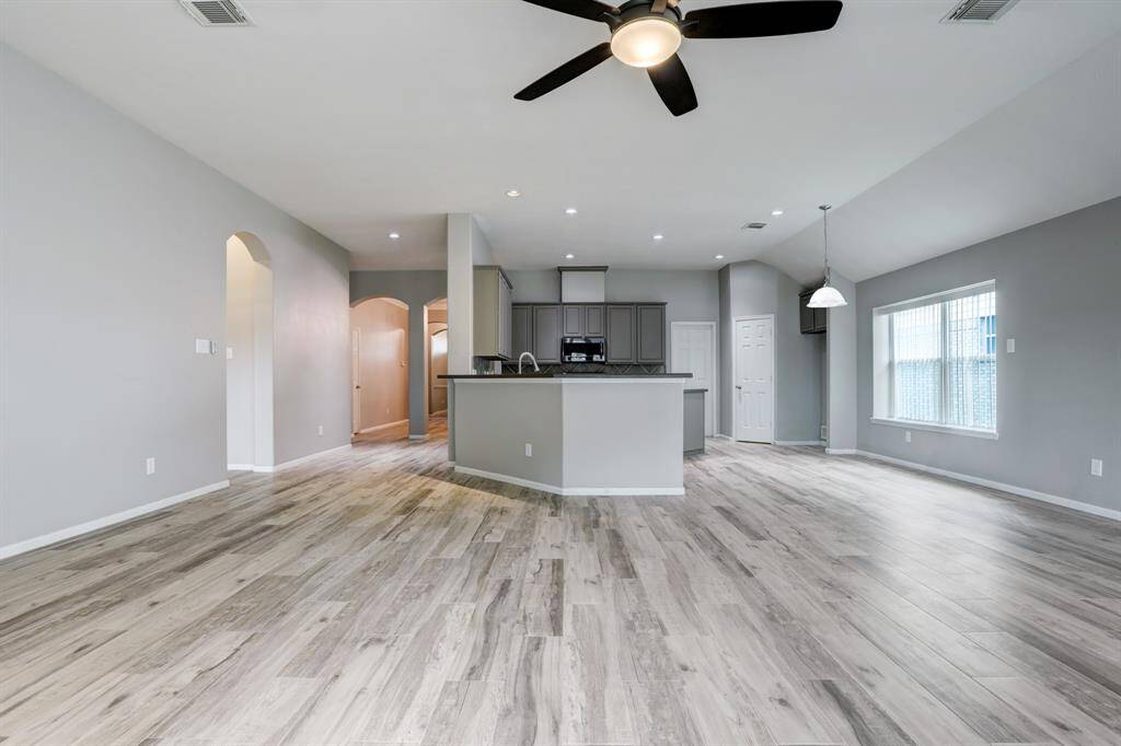 Experience seamless living with an open floor plan connecting the family room, kitchen, and entryway, perfect for modern lifestyles.