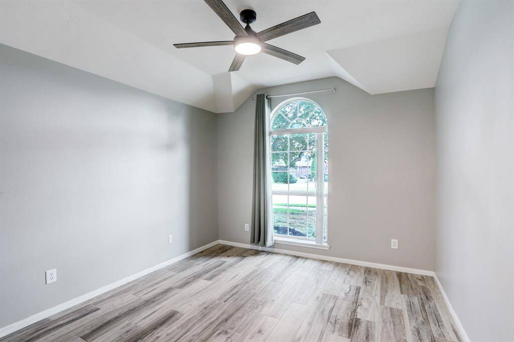 Bright and inviting, Bedroom 2 offers front-facing views and a modern ceiling fan for comfort.