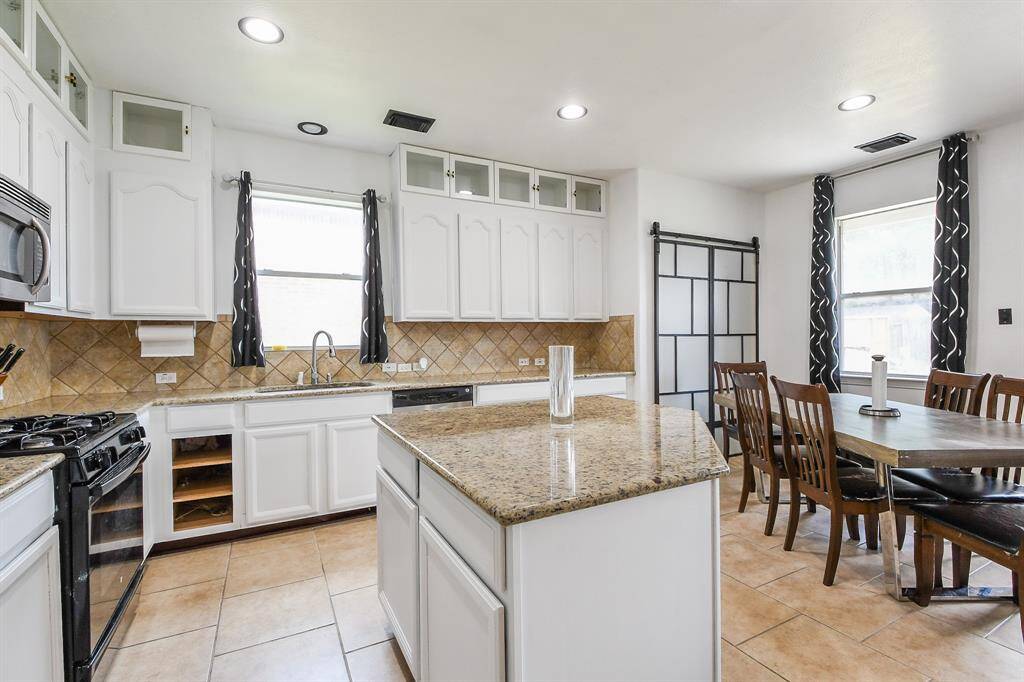 The shape of the center island invites prep/cooking tasks, and may even welcome a stool or two for quick snacking.You've got plenty of foot room wherever you land!