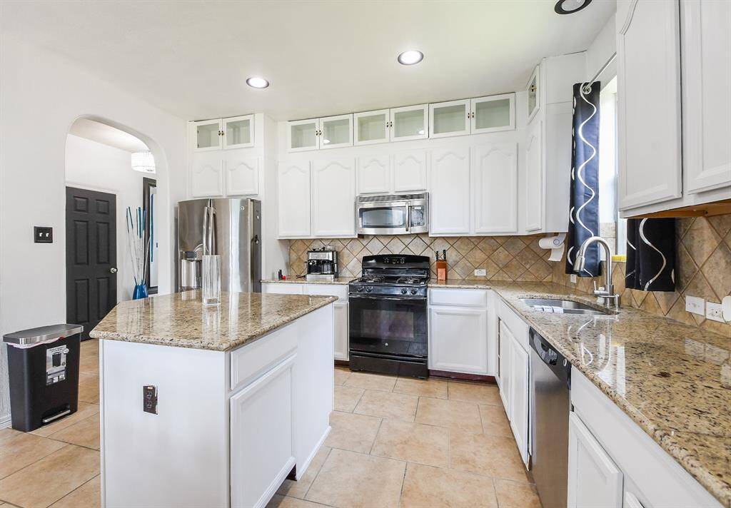 The shape of the island is solves prep/cooking task, and may even invite a stool or two for quick snacking.