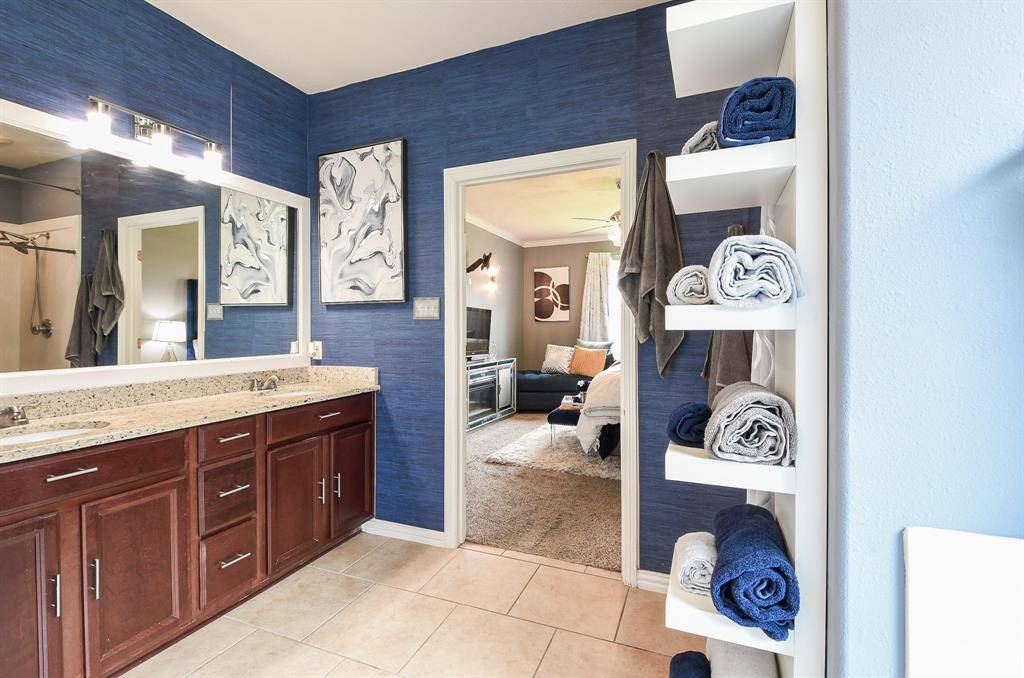 The modest walk-in shower sits side-by-side with the tempting garden tub.