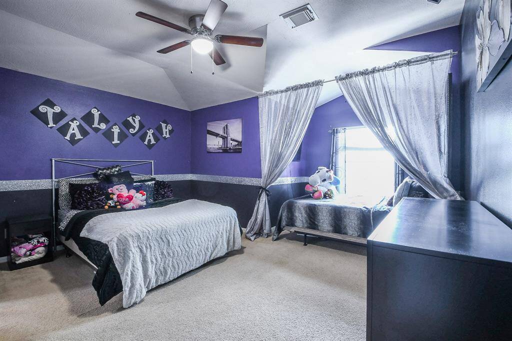 A secondary carpeted bedroom offers its own ensuite bath, left.