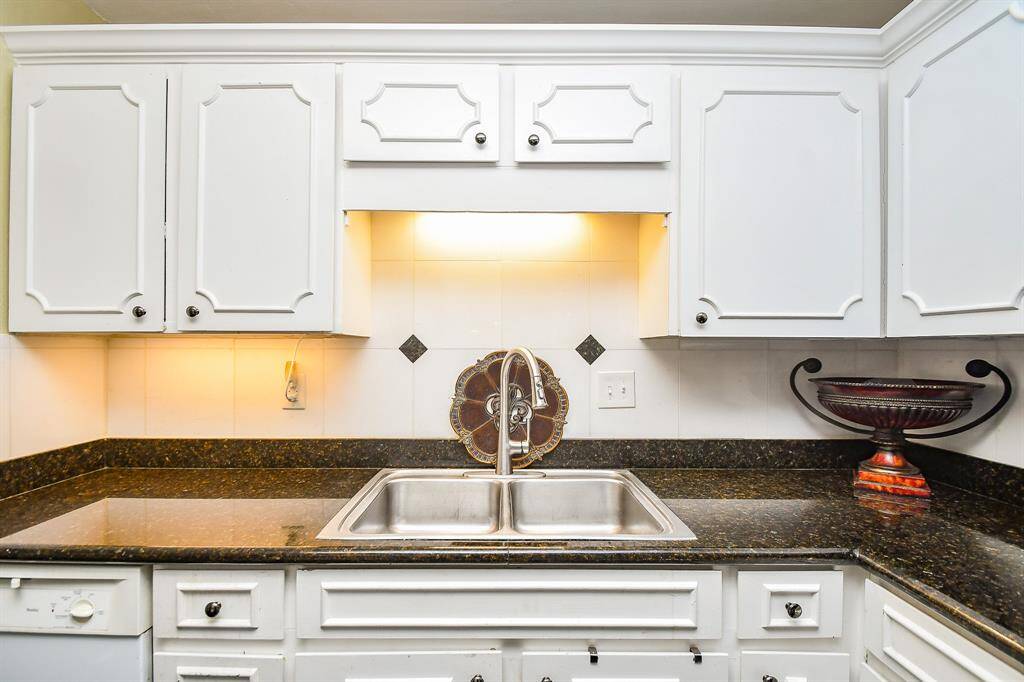 These white cabinets and the granite counters are sure to please!