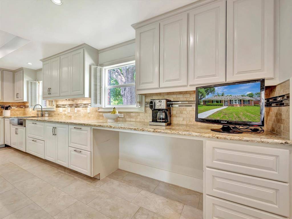 Kitchen is full of cabinet storage space