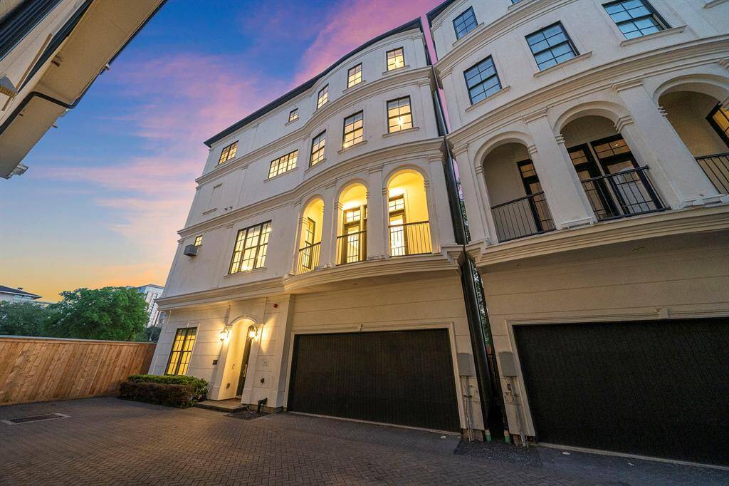 Distinguished by timeless stucco arches, black-trim windows, and extensive balconies, this stately corner-unit residence offers elevated curb appeal and modern sophistication. The double-wide garage and illuminated entry include premium security and lock-and-leave ease, while the absence of rear neighbors ensures privacy in this exclusive enclave.