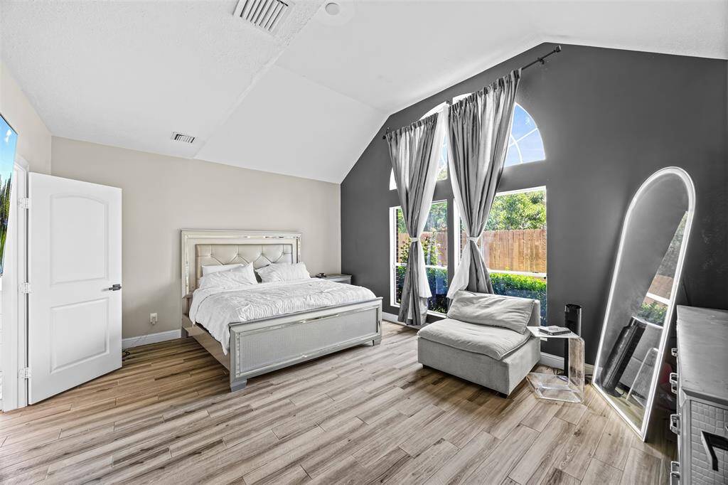 The spacious primary suite on the main floor features a private retreat with a large ensuite bath and generous closet space. Upstairs, four additional bedrooms and a versatile game room provide flexibility for guests, hobbies, or remote work.