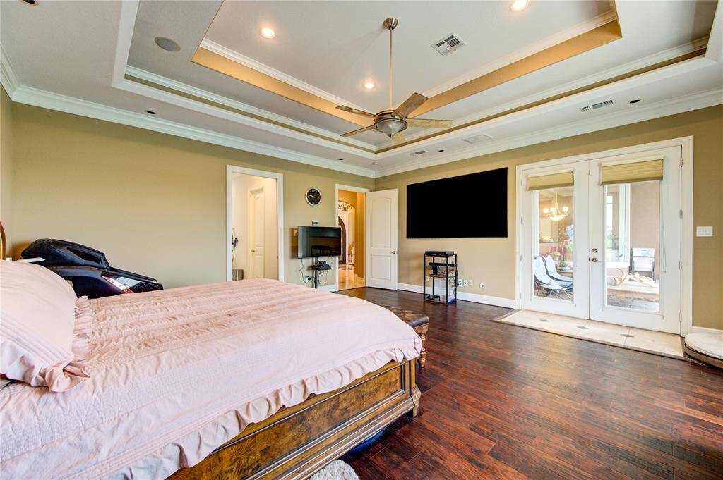 from primary room through double French door to backyard