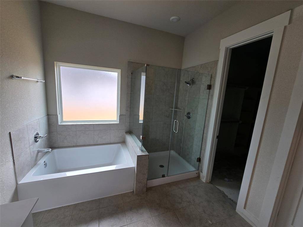 The elegant finishes, from the dazzling floors to the chic light fixtures, reflect a careful attention to detail that feels both luxurious and comforting.