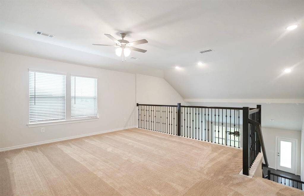 Expansive gameroom opens to living room downstairs