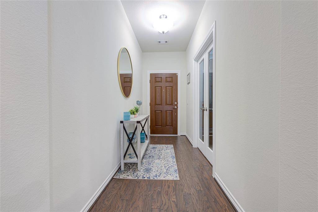Welcoming entry with french doors leading to your study