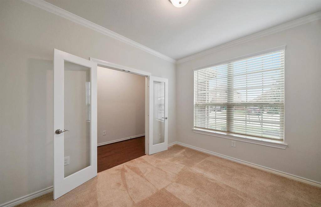 The study offers lots of natural light and is located as you enter the front door.