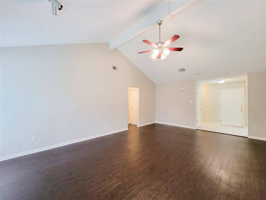 Family room view looking back toward entry and secondary bedrooms