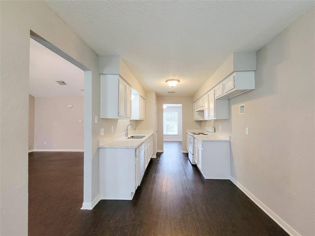 View from breakfast area looking into kitchen combo