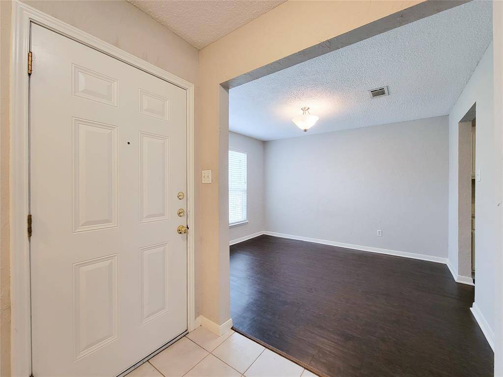 Looking from entry to left at formal dining or can be an office