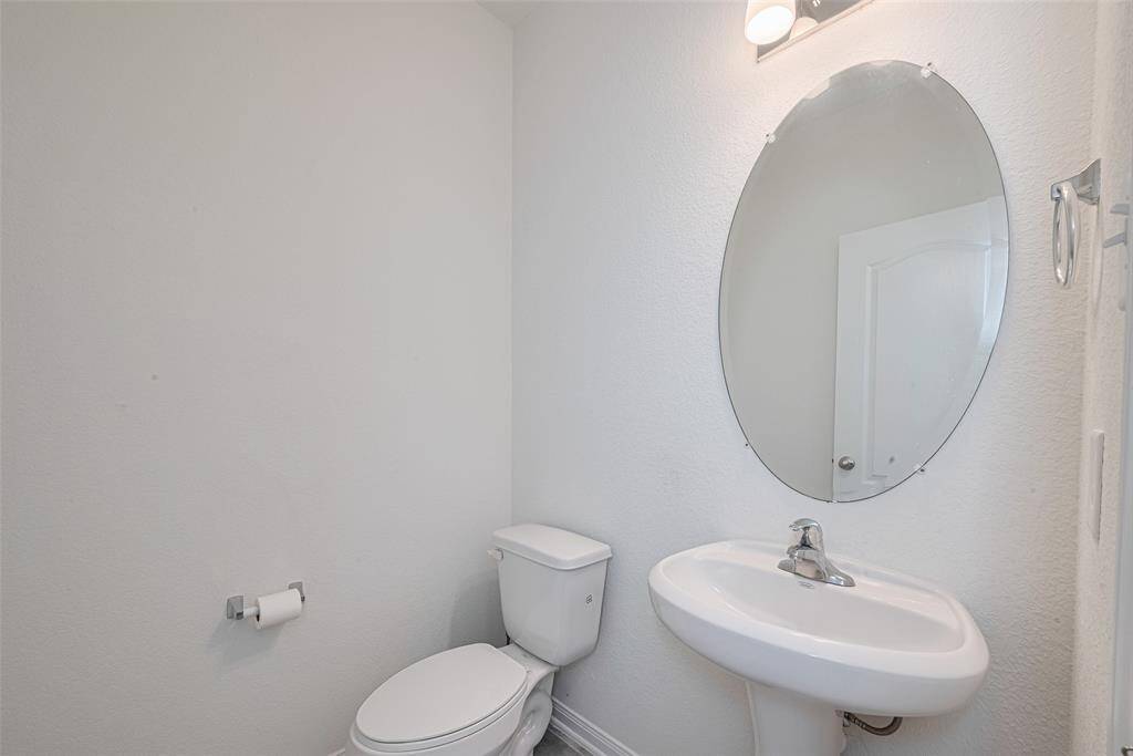 The Half Bath with a Pedestal Sink is lager than most, no claustrophobia in this space.