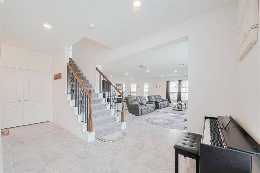 Wow What A Stunning way to be welcomed into the home with High Ceilings And Open Spaces! To the left you will find the Study, Half Bath and Garage.