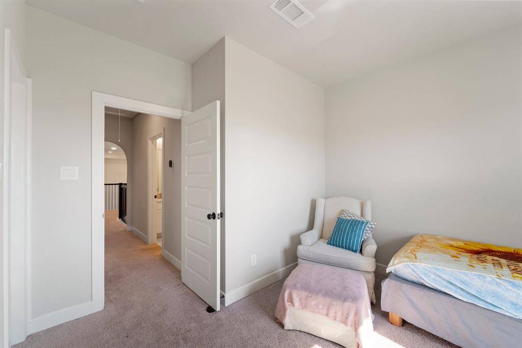 Secondary bedroom with natural light and flexible layout.