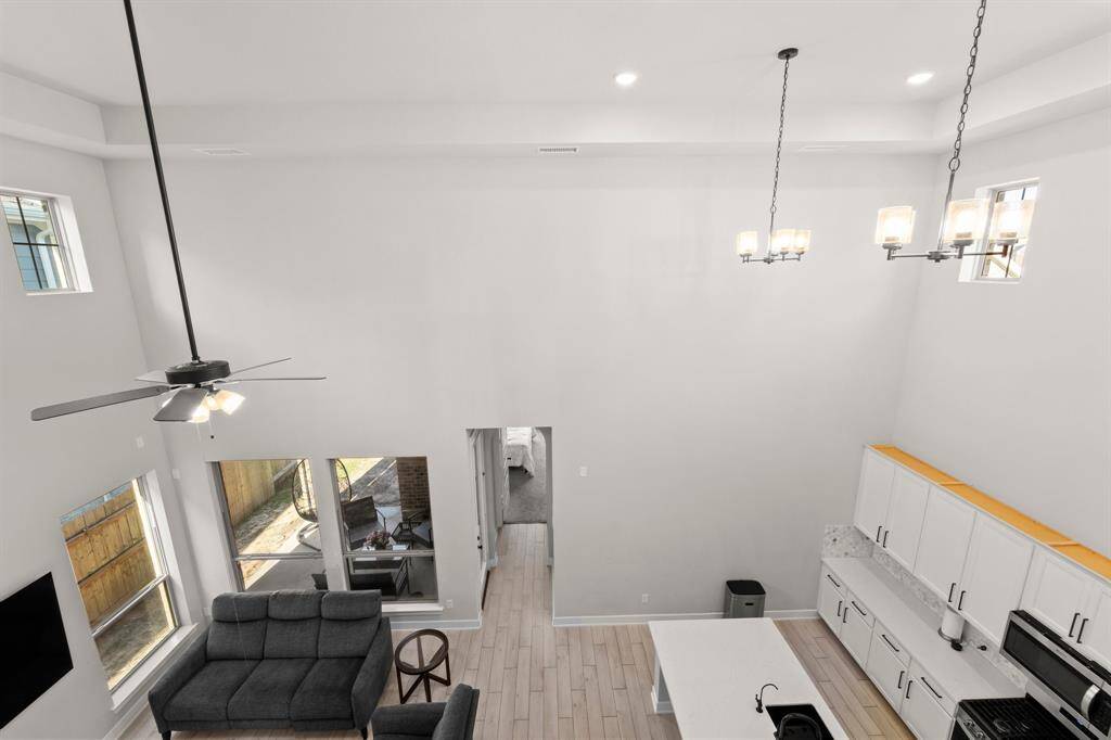 Stylish open-concept floor plan with sightlines from upstairs to living and dining areas.