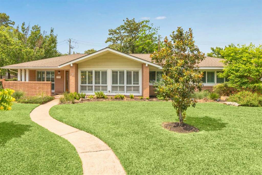 Live in drive less. This home is only 7 miles from downtown and zoned to Memorial Highschool. The home sits on a large lot with mature trees, ranch style, with original unpainted brick.