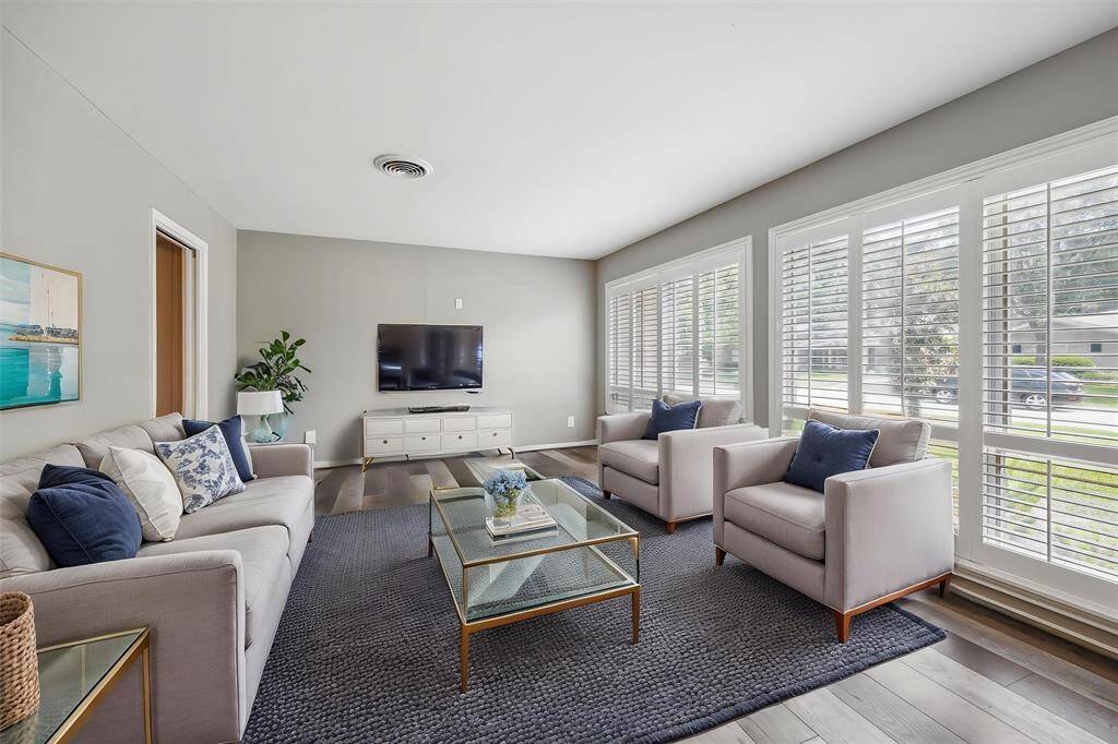 The front sitting room can be used as a living room, office, playroom, its a perfect flex room.
